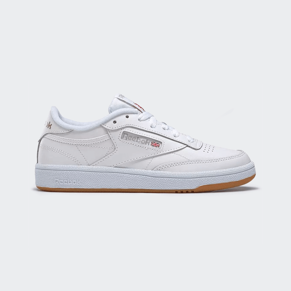 A top trend this year: Classic White Reebok Club C 85 sneakers with gum sole.