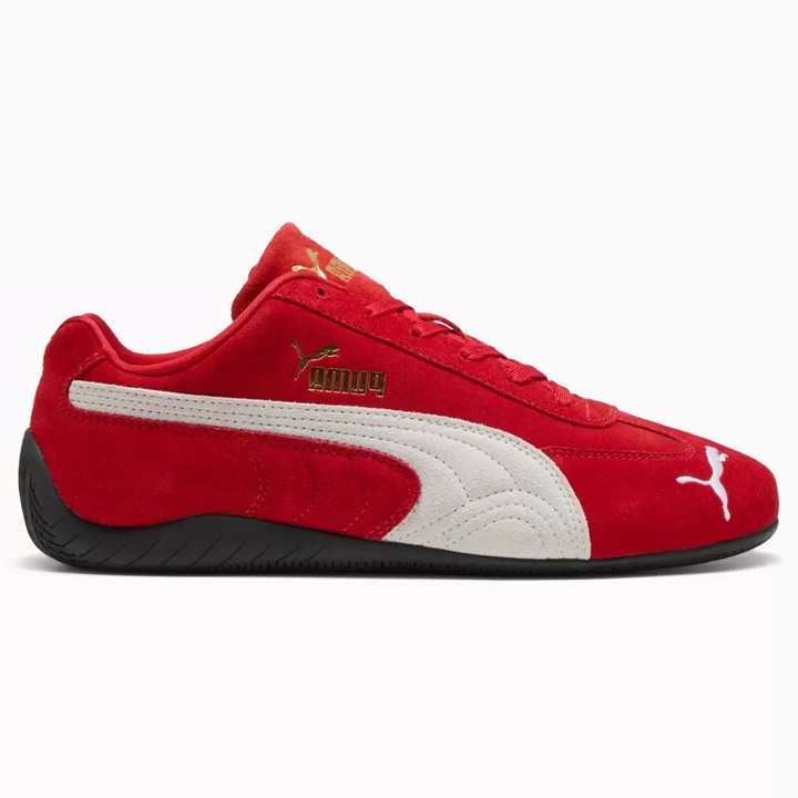 Sleek low-profile red suede PUMA sneaker with a contrast white PUMA stripe at the side and contrast white PUMA cat logo embroidered at the side toe. Contrast black rubber outsole. Contrast gold metallic PUMA cat logo branding at the tongue and side.