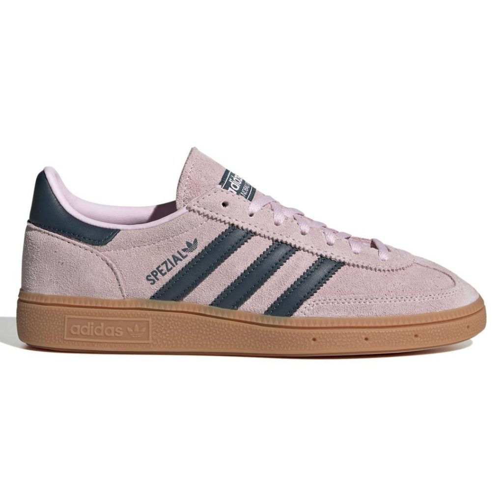 Dusty rose/light pale pink low-top suede adidas sneaker with contrast black/midnight blue 3-Stripes at the side and heel panel at the back. Tonal light pale pink laces at the top. Contrast brown gum rubber outsole. 2025 best school shoes